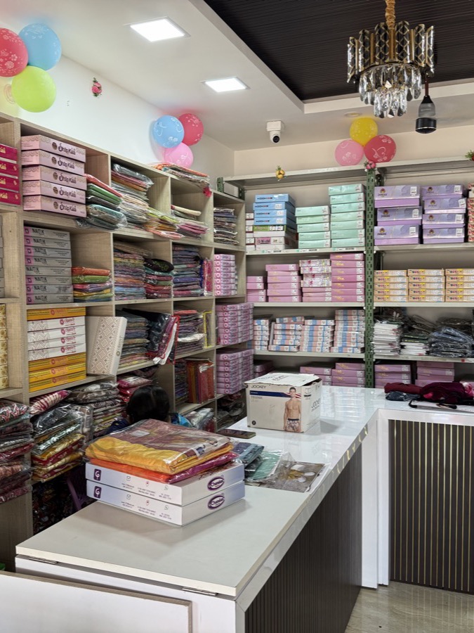 Colourful clothing collections and display counter at R3