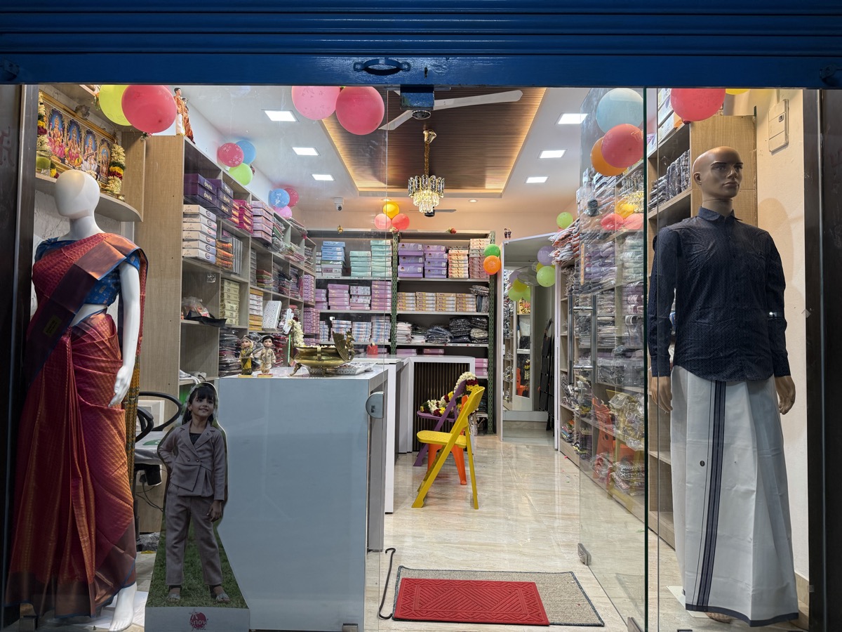 Entrance of the R3 Silks and Readymades store, with saree and menswear displays